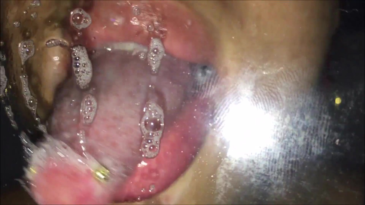 Latina Girl Licks Glass with Tongue